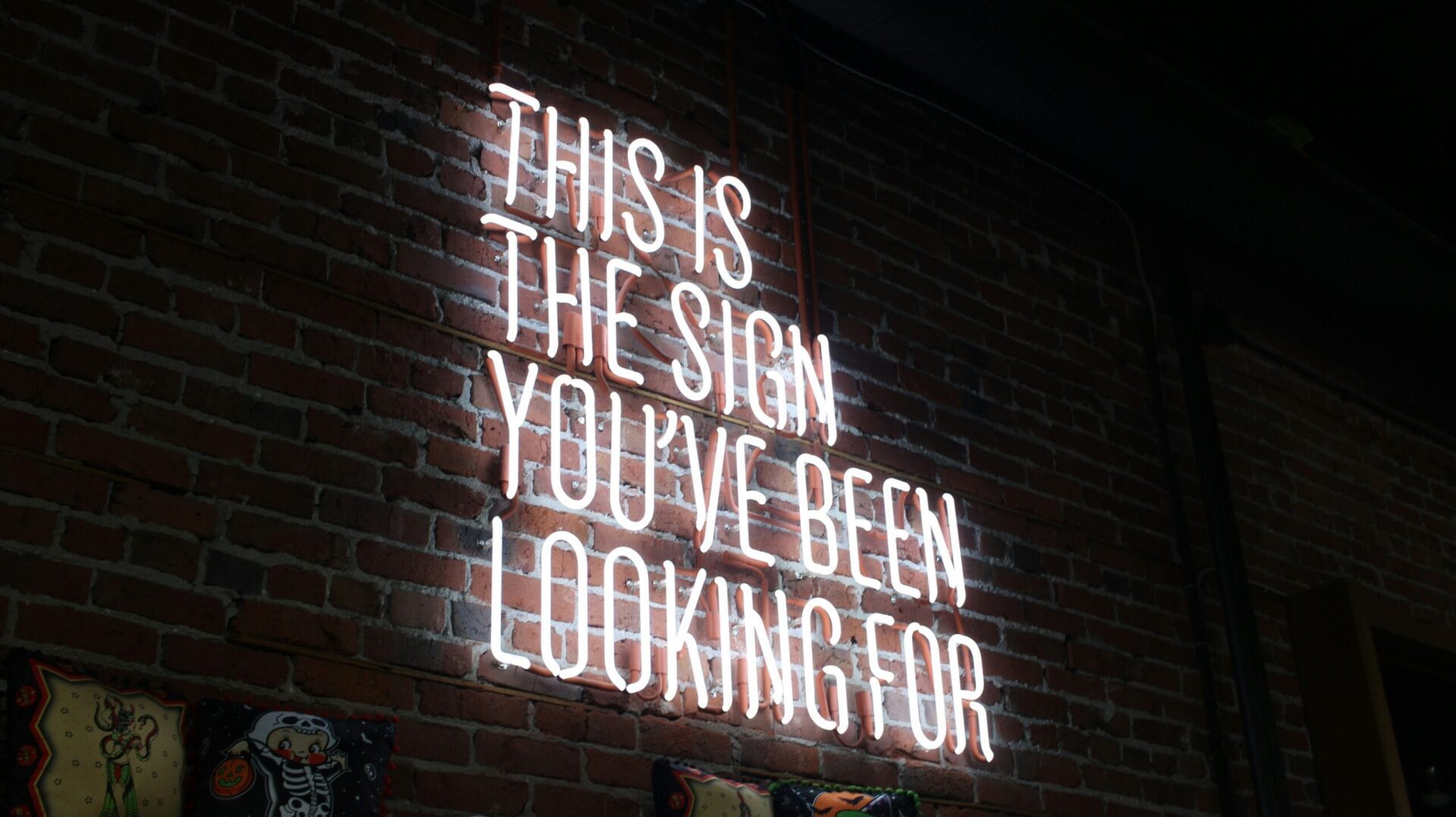 This is the sign you’ve been looking for, glowing neon message representing instant clarity in web design. Photo by Austin Chan