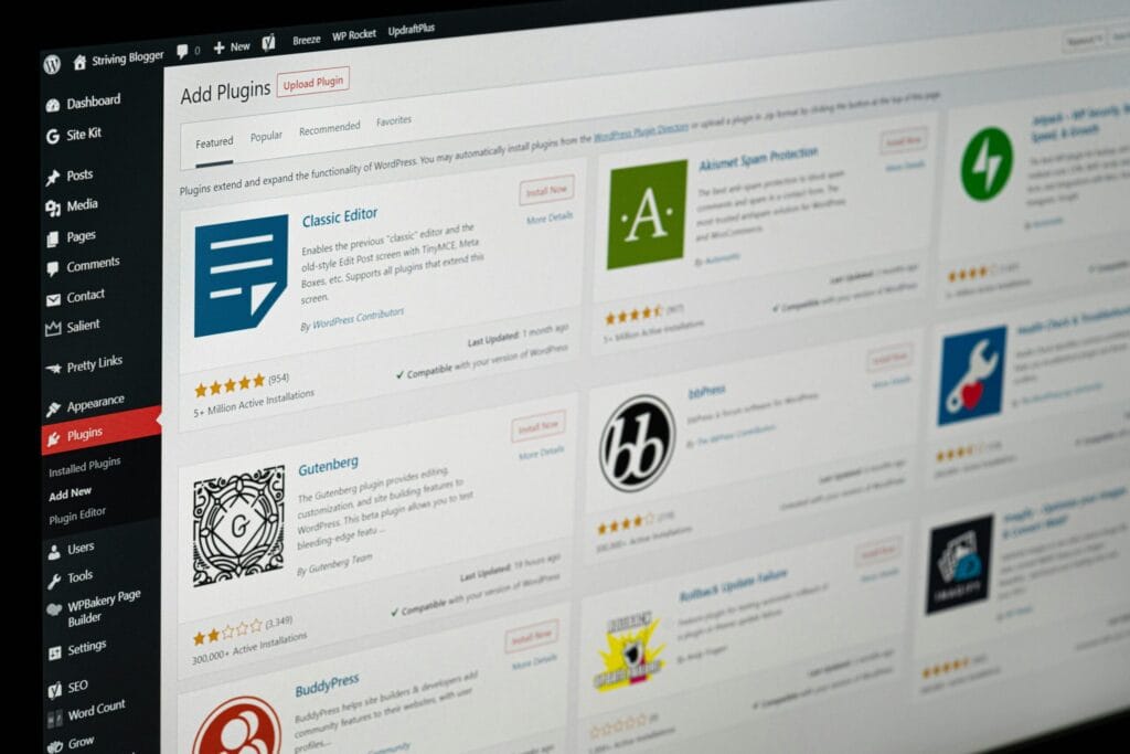 WordPress plugin update and management screen on laptop display, photo by Justin Morgan