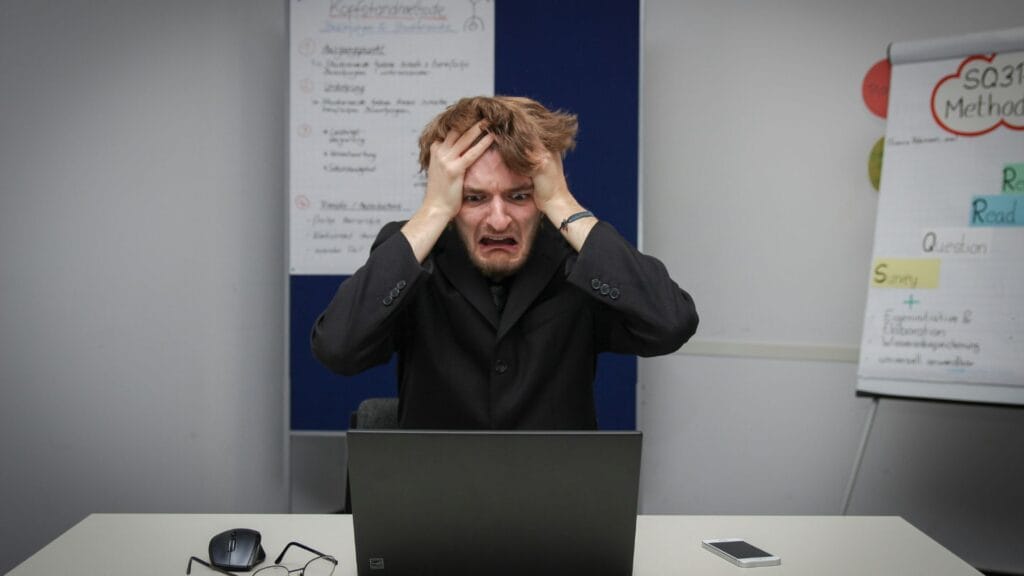 Man frustrated from his laptop. 