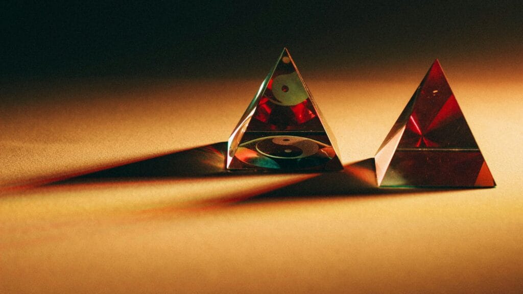 Glass prism splitting light to represent website as a sales tool bringing clarity and focus online photo by Fernando Cferdo.