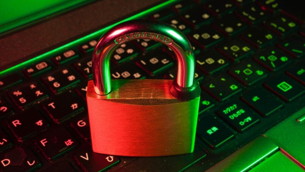 An image of a padlock on a laptop keyboard. Photo by Flyd.