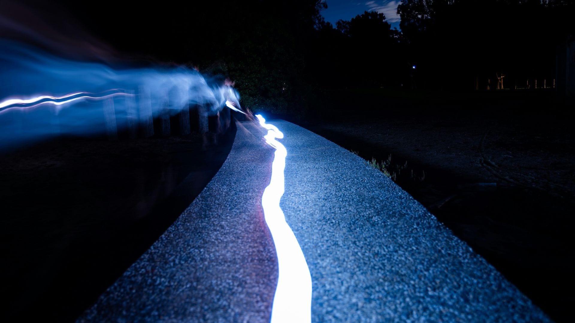 Abstract blue light pathway representing a website guiding users towards action and conversions photo by Matt Str.